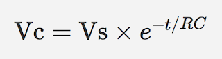 Formula for the voltage of a discharging capacitor at a given moment in time